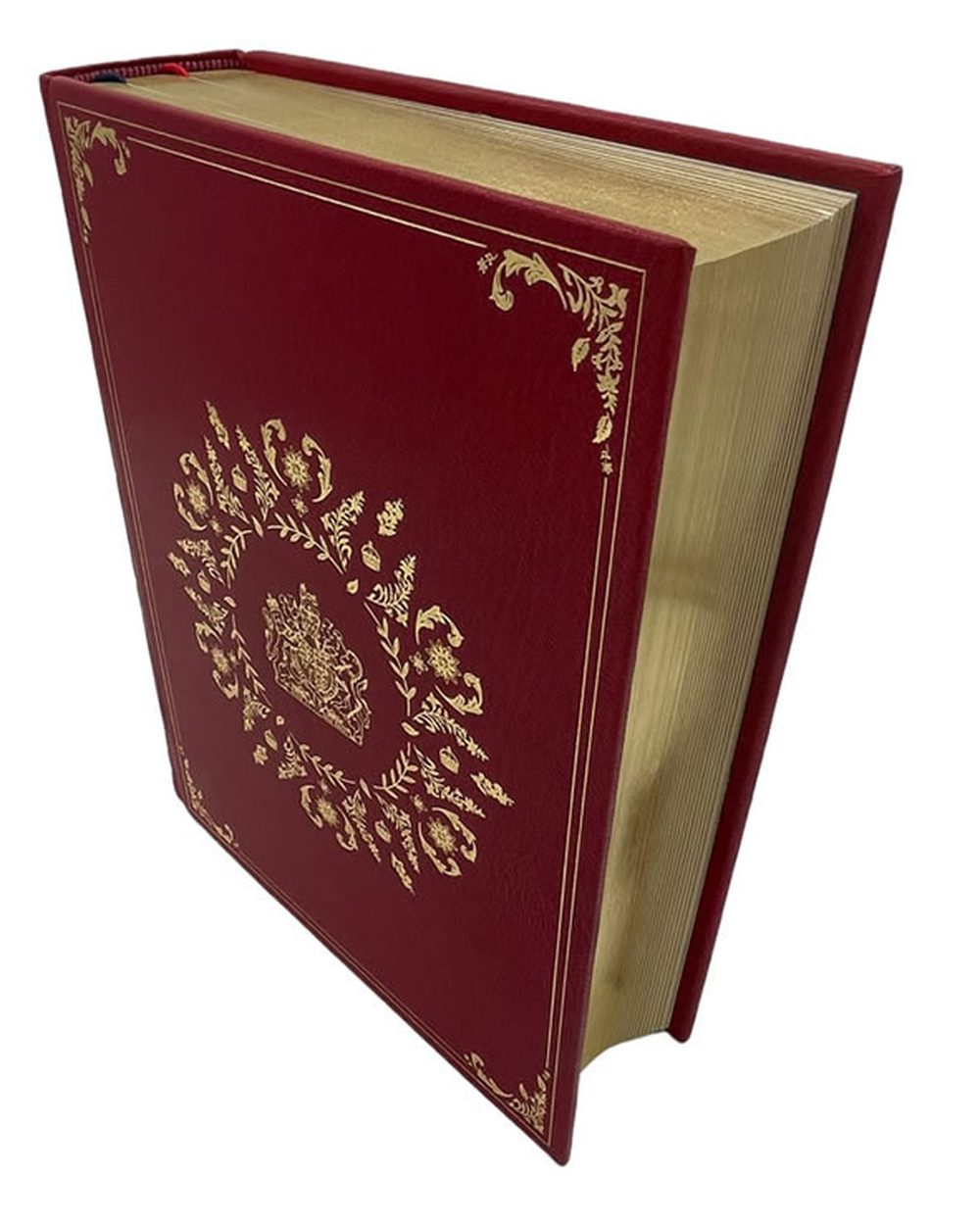A red morocco leather bible with gilt tooling and gilt page edges, bound by Ludlow Bookbinders